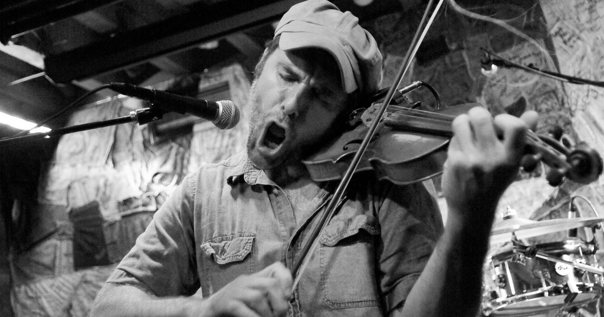 Possess by Paul James (Konrad Wert) playing fiddle in black and white