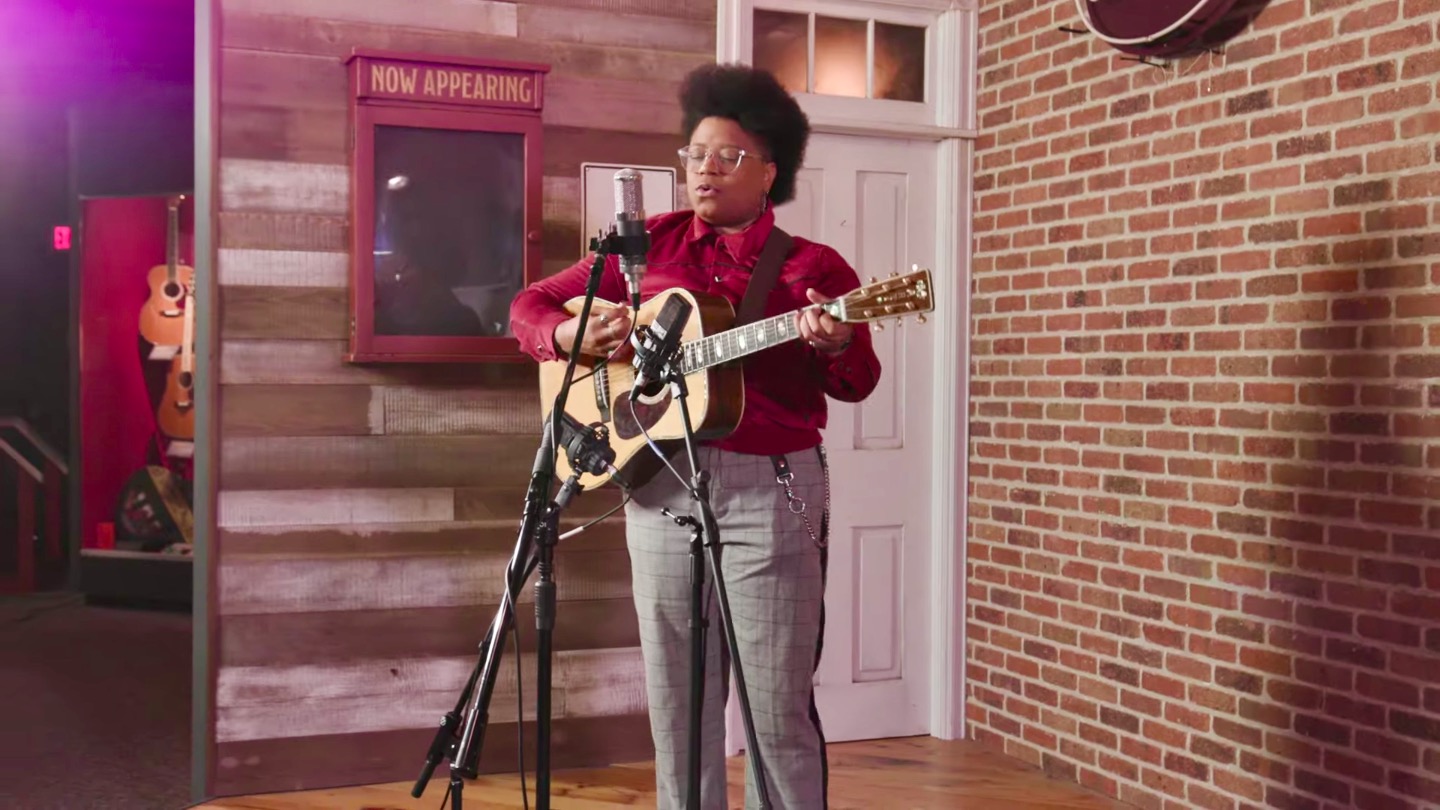 Amythyst Kiah performs in front of two condenser microphones with a 1942 Martin D-45
