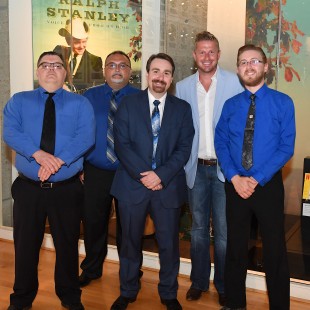 Ralph Stanley II (center) poses with the current iteration of the Clinch Mountain Boys and Josh Trivett (second from right) of Moonstruck Management.