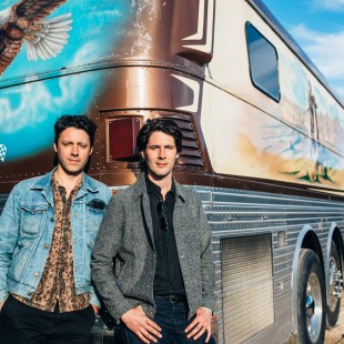 The Cactus Blossoms photobombed by Willie's iconic bus.
