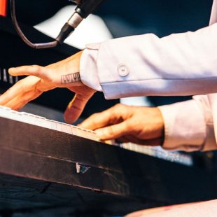 An apropos tattoo on piano man Robert Ellis