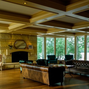The great room, cozy while spacious, with amazing views of the grounds and lake.