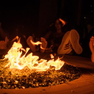 An unseasonably cool summer evening is the perfect occasion to light a fire to warm up a few toes.