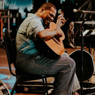 Purveyor of old-time and down home blues, it's Jerron "Blind Boy" Paxton.