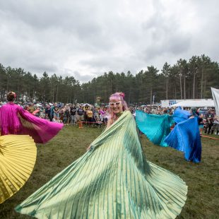 Torch Sisters bring a pop of color against a gloomy sky.