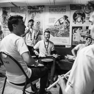 Our valiant drum line warms up backstage.