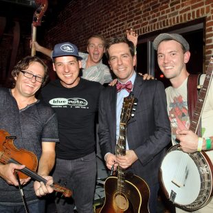 NASHVILLE, TN - SEPTEMBER 18: Ed Helms (second from right) gathers with the Infamous Stringdusters backstage at the Bluegrass Situation showcase at Americana Music Festival on September 18, 2013 in Nashville, United States. (Photo by Erika Goldring/Getty Images for Americana Music Festival) *** Local Caption *** Ed Helms