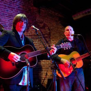 NASHVILLE, TN - SEPTEMBER 18: (L-R) Ian Riggs, Larry Campbell and David Bromberg perform at the Bluegrass Situation showcase during the Americana Music Festival on September 18, 2013 in Nashville, United States. (Photo by Erika Goldring/Getty Images for Americana Music Festival) *** Local Caption *** Ian Riggs; Larry Campbell; David Bromberg