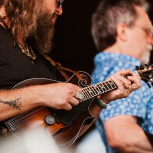 Paul Hoffman of Greensky Bluegrass and Jerry Douglas perform during the Earl Scruggs Revue tribute show. Photo by Cora Wagoner
