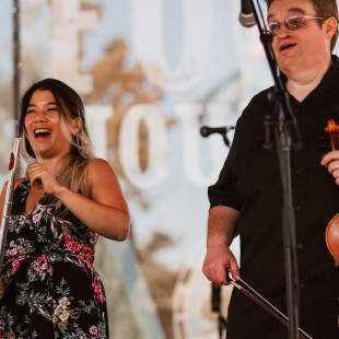 Anh Phung of Twisted Pine with Michael Cleveland at the Earl Scruggs Revue tribute. Photo by Cora Wagoner.
