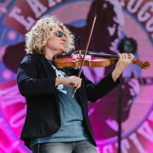 Deanie Richardson, fiddler and band leader of Sister Sadie, on the Flint Hill Stage. Photo by Cora Wagoner.