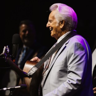 Del McCoury smiles during his headline set on the Flint Hill Stage at Earl Scruggs Music Festival. Photo by Cora Wagoner.