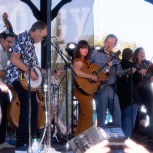 Della Mae and Michael Cleveland join Tony Trischka and band during the Earl Scruggs Revue set. Photo by Eli Johnson