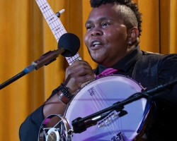 Crys Matthews picks up a banjo during her set. (Photo by Ben Noey Jr.)