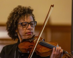 Dary Ford-James of the Black Banjo & Fiddle Fellowship plays the fiddle.
