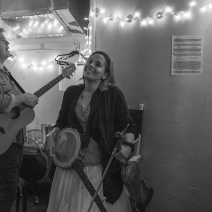 Dirk Powell and Rhiannon Giddens in a dressing room backstage during A Bluegrass Situation. By Josh Wool.