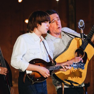 Young mandolin phenom Wyatt Ellis joins the house band on stage during his first time appearing at Newport Folk. By Nina Westervelt.