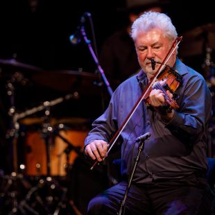 Gerry O'Connor plays fiddle.