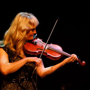 Jessica Willis Fisher plays the fiddle during Folk iN Fusion.