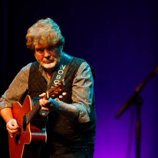 Mac McAnally of the Coral Reefer Band performs.