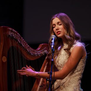 Niamn Noade, playing the harp.