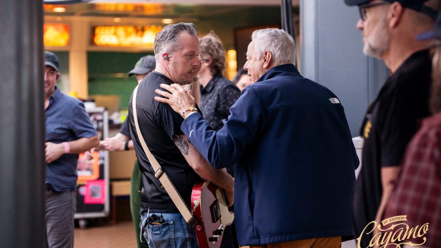 Jason Isbell and Tommy Emmanuel talk backstage.