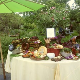Some of the culinary offerings at Frogs Leap Winery, showcasing fresh, local produce alongside cheeses, breads, sweets, and snacks.